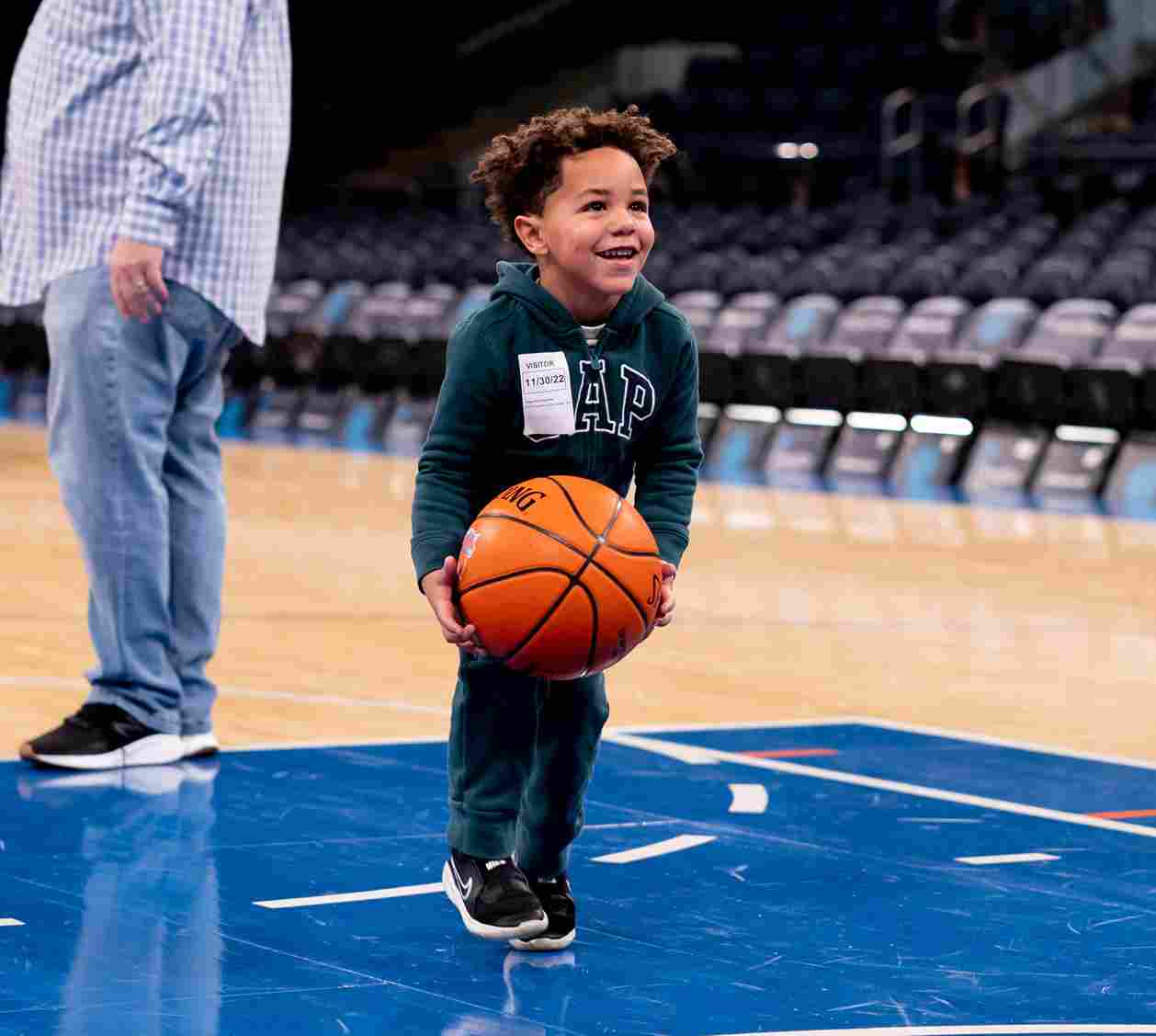 Young person shoots on Madison Square Garden court